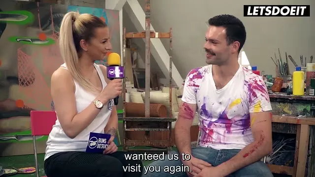 Inked Blonde Artist Flirts Amid Paint Strokes